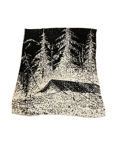 Mountain Cabin Throw A close-up photo of the back side a mountain cabin throw showcasing a rustic design in black and white