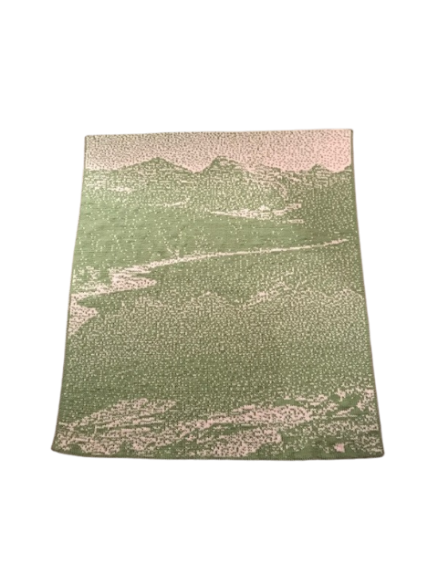 Mountain Lake Throw A close-up photo of a double knit throw showcasing a beautiful mountain lake design in shades of green and cream.